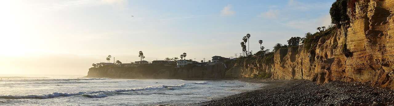 Cliffs and palms at Pacific Beach at sunset